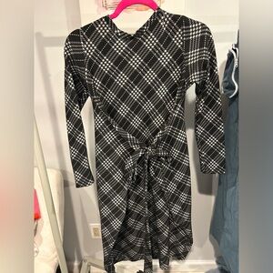 Knee length black and white dress with front tie detail